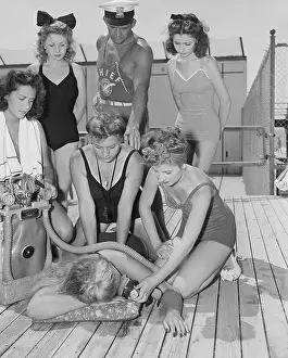 Lifeguards Practicing with Artificial Respiration