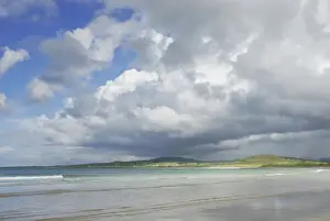 Eire Prints: Light patterns on flat sandy beach with clouds