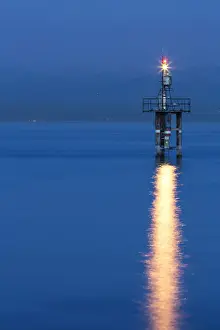 Lake Constance Prints: Lighthouse at Hoernle during the blue hour with a stormy atmosphere