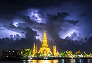 Boat Gallery: Lightning thunderstorm, rain, over Wat Arun, buddha temple famous landmark for travel by tourist