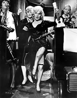 Prints of MARCH 29: Actors Marilyn Monroe, Jack Lemmon and Tony Curtis perform a scene from the movie Some Like It Hot directed by Billy Wilder and released March 29, 1959 Marilyn Monroe: The Eternal Star Prints: Some Like It Hot