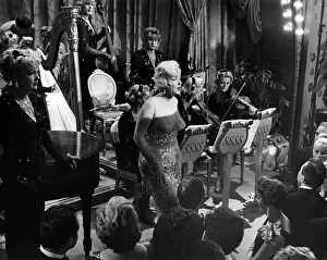 Prints of Marilyn Monroe with Tony Curtis and Jack Lemmon in drag in a scene from the movie Some Like It Hot in Los Angeles (Photo by Richard C. Miller/Getty Images) Marilyn Monroe: The Eternal Star Prints: Some Like It Hot Film Still