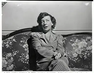 Lillian Hellmann Sitting on Sofa at Home