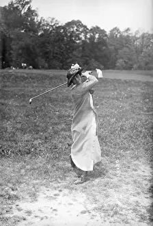 Prints of (Original Caption) 5/25/14-West Orange, New Jersey- Miss Lillian B. Hyde at the Women's Metropolitan Golf Championship in West Orange, NJ Swing Through History: Lillian Hyde Swings Golf Club Outside