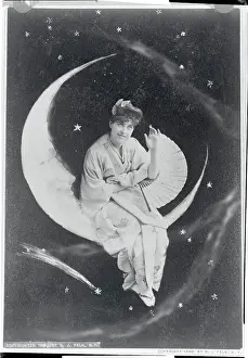 Lillian Russell Sitting on Moon Prop