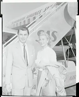 Linda Christian and Edmund Purdom near Airplane