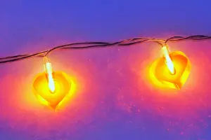 Prints of Lit heart-shaped fairy lights in the snow Valentine Day Print Prints: Lit heart-shaped fairy lights in the snow