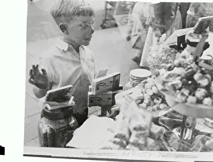 Little Boy Looking Into a Candy Shop