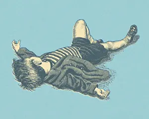 Little Boy Lying on the Ground