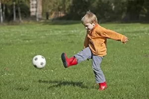 Images Dated 9th October 2011: Little boy playing soccer