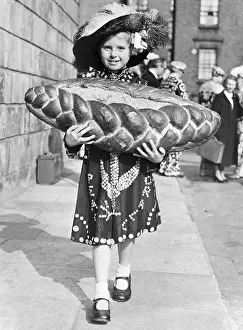 Outfit Prints: Little Girl Carrying A Loaf Of Bread