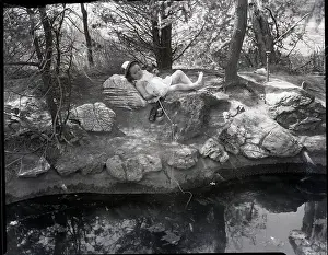Little Girl Fishing Under Shade by Pond