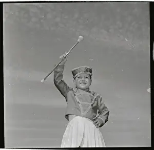 Little Girl Holding Baton in Air