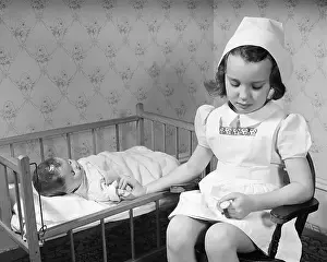 Watch Prints: Little Girl Playing Nurse
