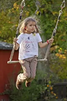 Blond Hair Prints: Little girl on a swing