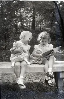 Toddler Prints: Two Little Girls Sitting On A Bench