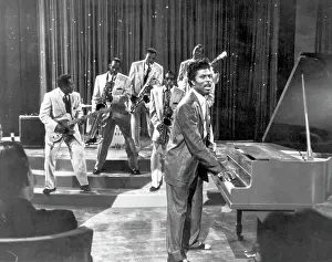 Prints of CIRCA 1957: Musician Little Richard performs onstage with his band at the piano in circa 1957. (Photo by Michael Ochs Archives/Getty Images) The Architect of Rock: Little Richard Movie Still