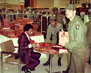 Prints of CIRCA 1977: Musician Little Richard returns to Christianity after personal turmoil and signs copies of the Black Heritage Bible for members of the US Army in circa 1977 The Architect of Rock: Little Richard Signs Autographs