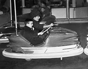 Fairground Prints: Liz Taylor and Son Michael Riding in Bumper Car