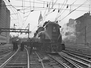 Penn Station: Echoes of Transit: Locomotive Pulling Into Station