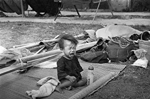 Lone Crying Child on Ground in Vietnam