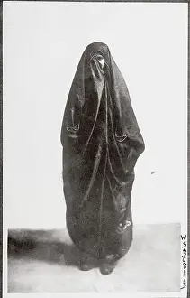 Lone Moslem Woman in Shrouded Attire