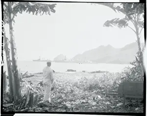 Lone Sailor Gazing From Shoreline