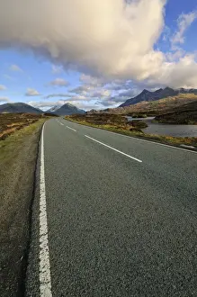Lonesome road neat to Loch nan Eilean near Sligachan with view of Bruach na Frthe and Sgurr nan Gillean Mountain Peaks of the Black Cuillins Mountain Range, Isle of Skye, Scotland, United Kingdom