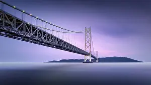Time Exposure Prints: Long exposure of a colourful dusk at the illuminated Akashi Kaikyo Bridge