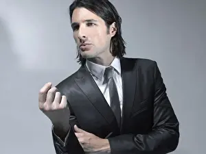 Suit Prints: Long-haired man in his early thirties wearing a suit, fashion shoot