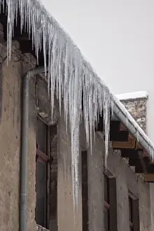 Icicle Prints: Long icicles on a building