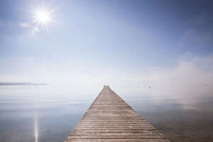 Mist Collection: Very long jetty on Chiemsee Lake with high fog and sun near Seebruck, Bavaria, Germany, Europe