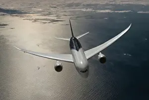 Look-down view of a Boeing 787-8 Dreamliner flying over the ocean