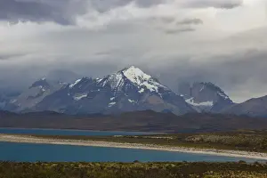 Jagged Prints: Looking across the turquoise waters of Lake Sarmiento to the snow-capped mountain peaks of the Torres del Paine