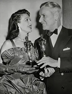 Loretta Young and Ronald Colman Holding Their Oscars