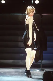 Prints of LOS ANGELES - SEPTEMBER 1989: Pop singer Madonna performs onstage in spandex and a bustier with back up dancers in September 1989 in Los Angeles, California Experience the Evolution of the Queen of Pop: Los Angeles Concert