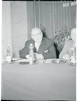 Lothar Bolz Sitting at a Table