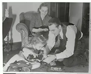 Prints of (Original Caption) Hoops Through Time: A Visual Journey of Basketball History: Lou Boudreau Enjoying His Family at Home