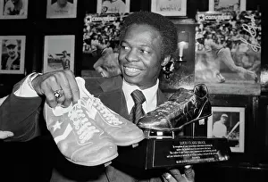 World Record Prints: Lou Brock Holding Shoes And Shoe Trophy