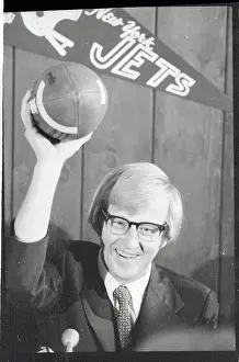 Lou Holtz Holding Football