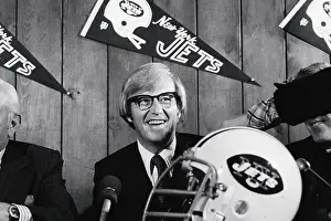 Lou Holtz Holding Football