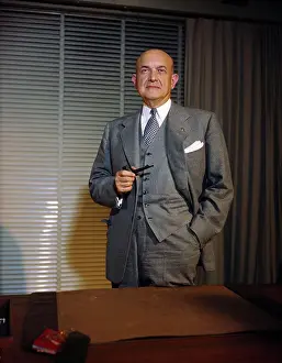 Louis A. Johnson Holding Pipe in Hand