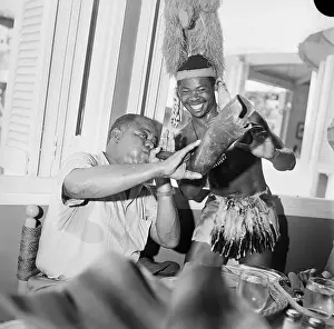 Louis Armstrong Receiving Gift from African Tribesman at World's Fair