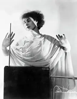 Gray Background Prints: Lucie Bigelow Rosen Playing Theremin