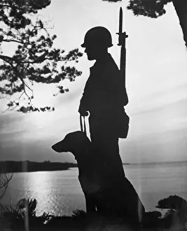 Lucien J. Vanasse and Dog Standing Guard