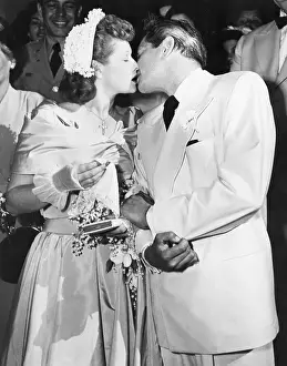Comedienne Prints: Lucille Ball Kisses Desi Arnaz at Wedding