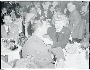 Lucille Ball Sitting With Desi Arnaz in Military Uniform