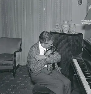 Lucky Luciano Embracing Miniature Doberman Pinscher