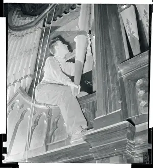 Notre Dame Prints: Ludwig Hellriegel Repairing Pipe Organ