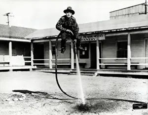 Hose Prints: Lupino Lane Lifted by Hose